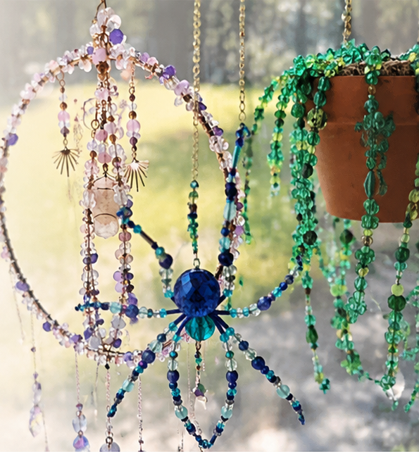 Lavender crystal hoop, blue beaded spider, and green hanging beaded plant